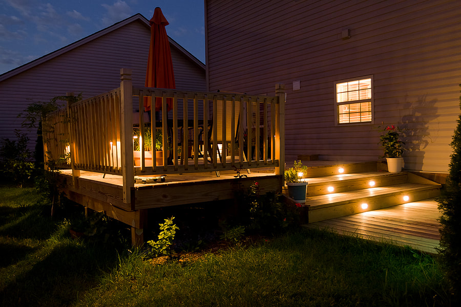 house's deck with lighting 